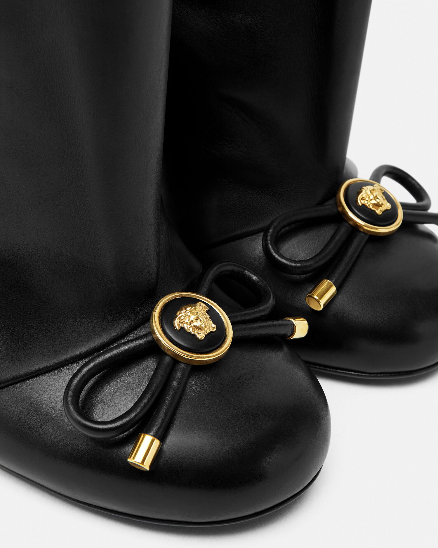 Versace knee high boots deals