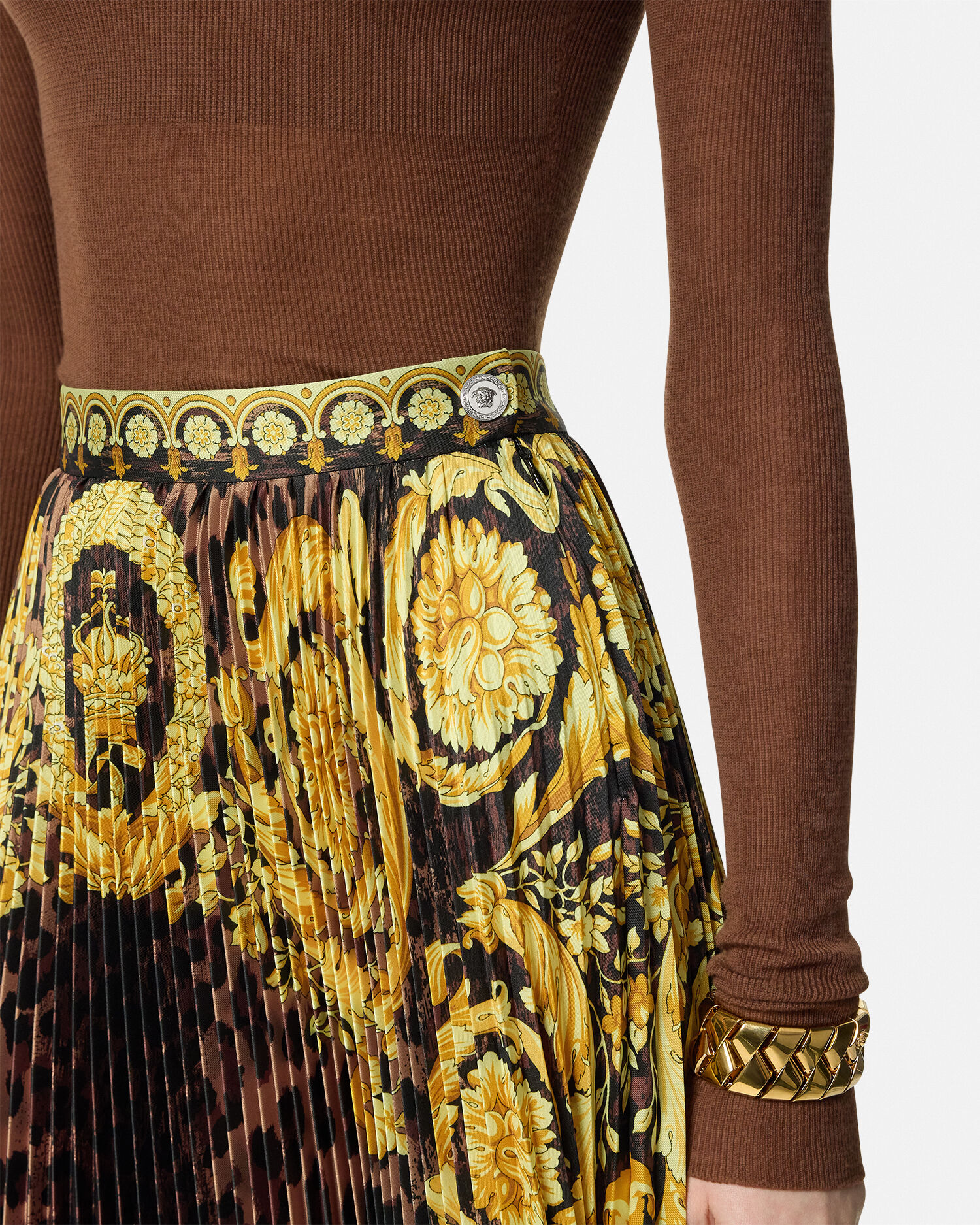 Black and gold pleated mini skirt top