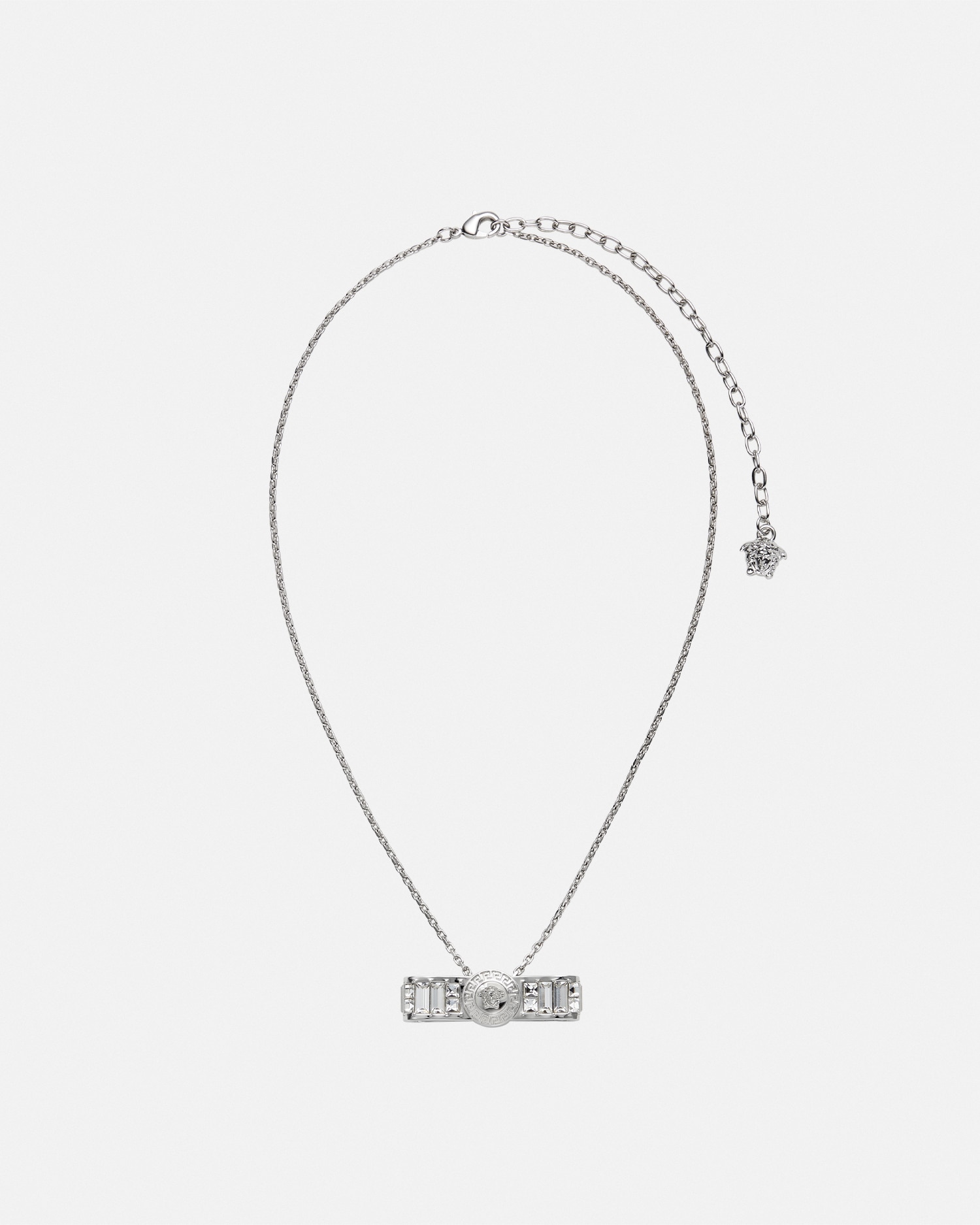 Versace Crystal Gianni Ribbon Pendant Necklace In Argent