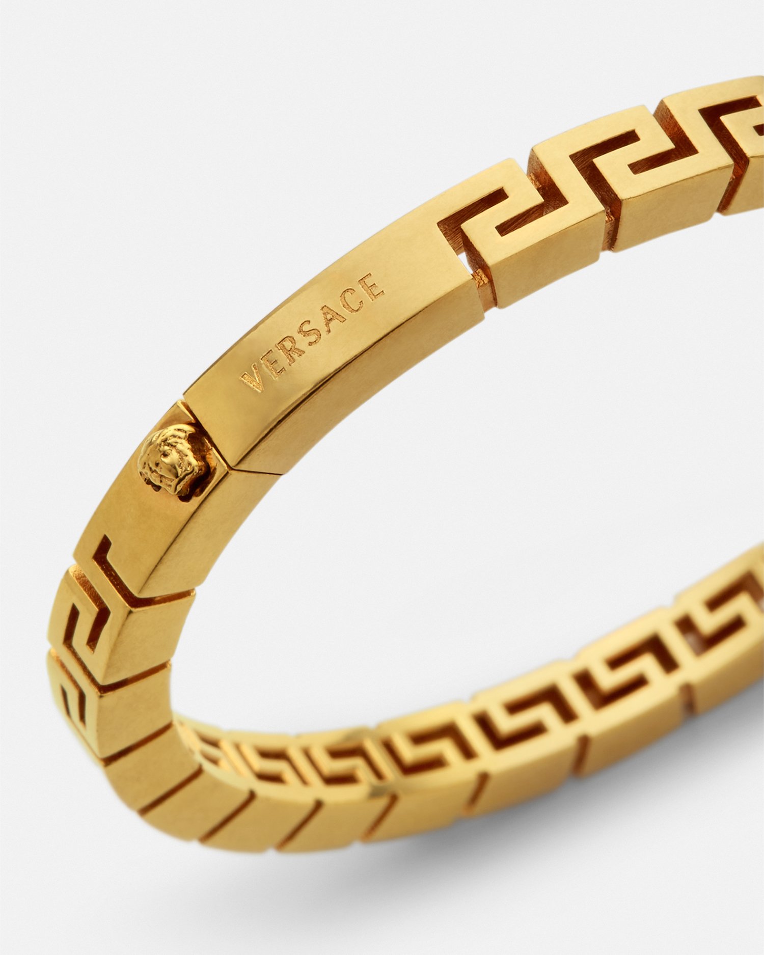 Shop Versace Greca Bangle Bracelet In Gold